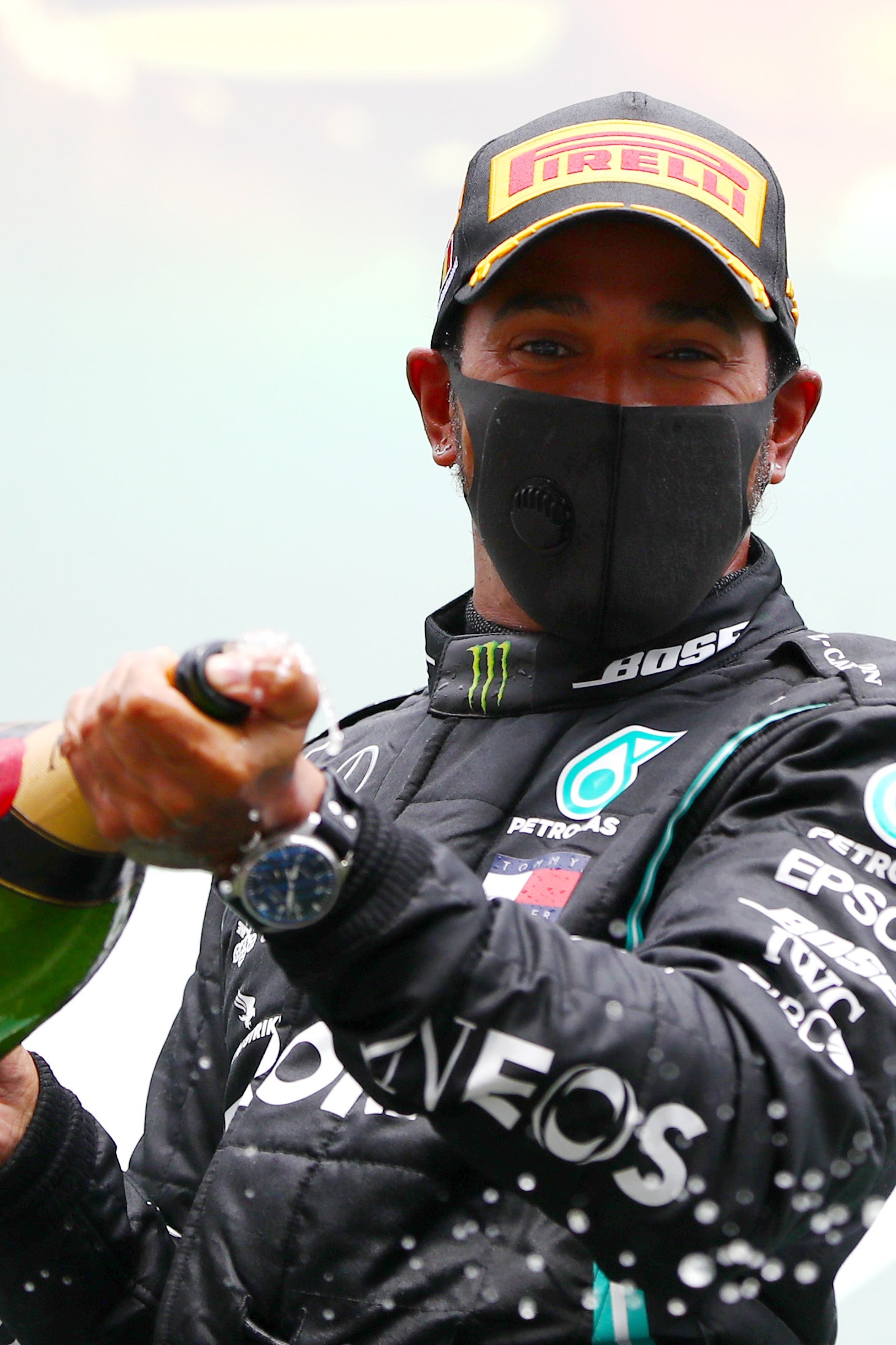 Race winner Lewis Hamilton of Great Britain and Mercedes GP celebrates on the podium