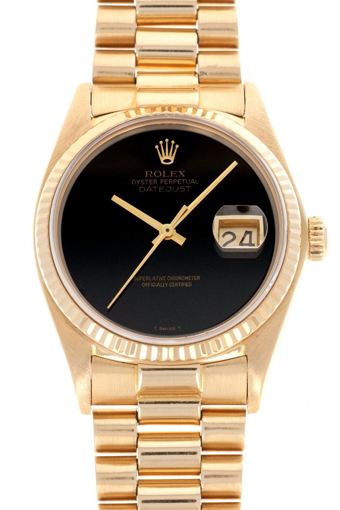 A gold and black rolex