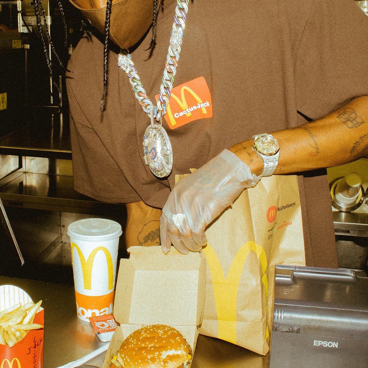 Travis Scott handling a bunch of mconalds food