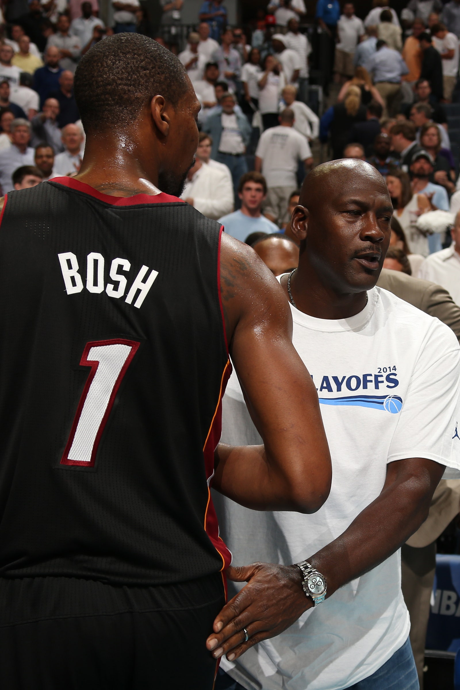 Michael Jordan dapping up Chris Bosh