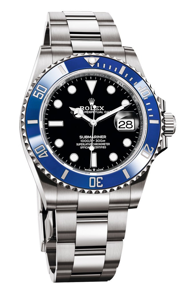 A silver rolex with a blue bezel and black face