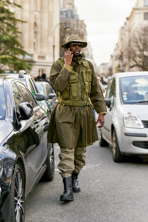 utility vest pants tucked into boots