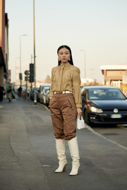 white boots pants tucked into boots