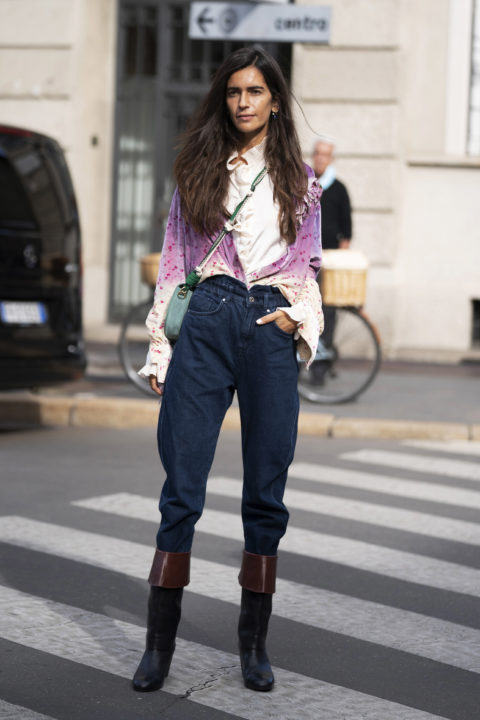 denim pants tucked into boots