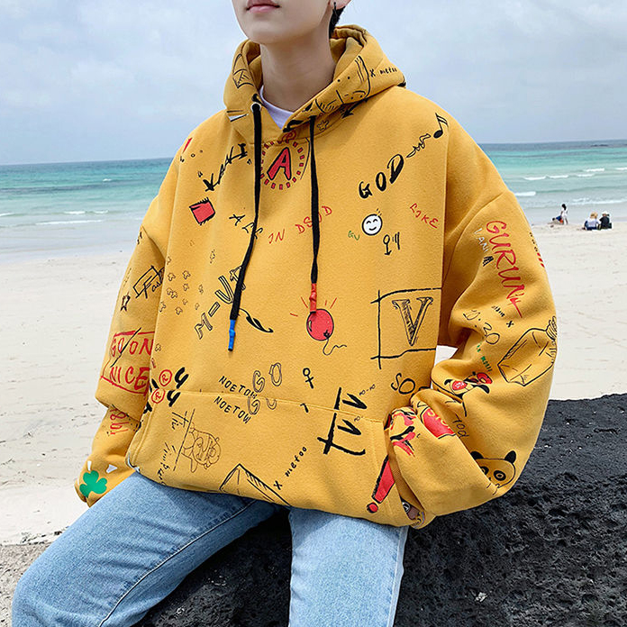 Yellow hoodie with black, red and white doodles