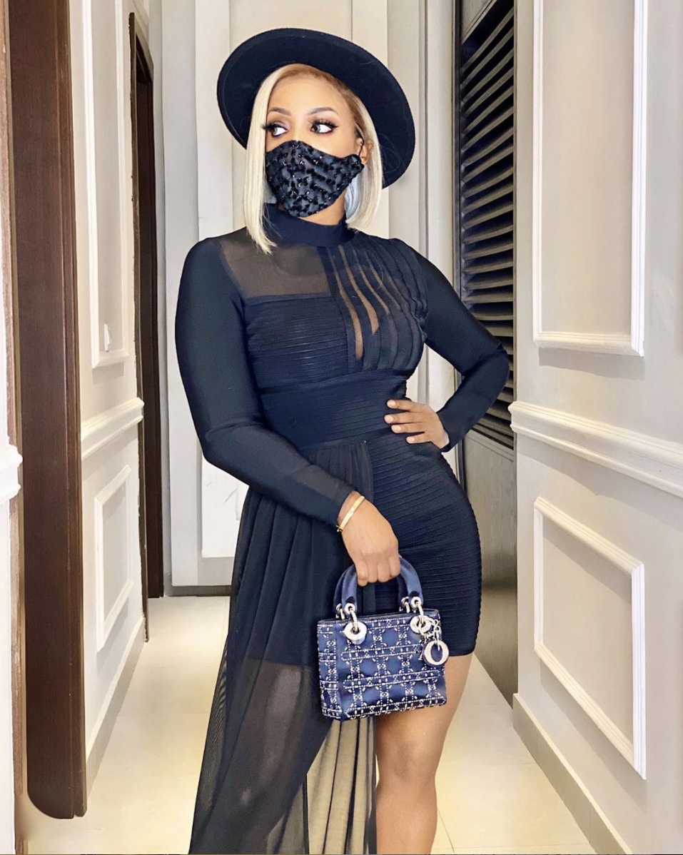 Chioma Ikokwu Black fedora sheer mini dress stylish facemask