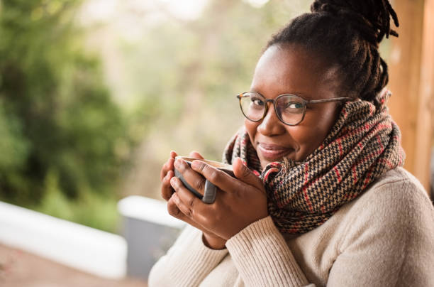 black woman wearing winter scarf and sweater