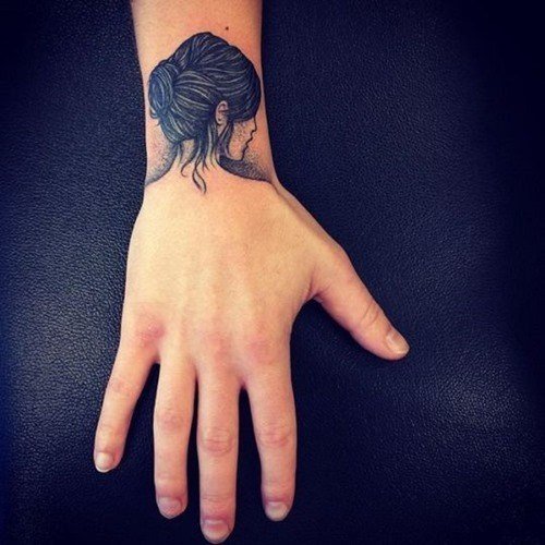 girl tattoo on wrist
