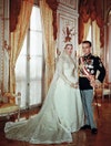 In the Cathedral of Monaco, Grace Kelly stunned the world in a wedding dress design by Helen Rose, a gift from the MGM studios, which went on to inspire many bridal designs. “The dress, created to complement the "fairy princess" beauty of the actress, features a bell-shaped skirt in ivory peau de soie supported by petticoats, and a high-necked bodice in Brussels lace, which was re-embroidered to render the seams invisible and then accented with seed pearls,” describes the Philadelphia Museum of Art where the dress is on display in Kelly’s native city. “Continuing the theme of pearl-embellished lace are the bride’s prayer book, shoes, headpiece, and circular silk net veil—designed so that Miss Kelly’s face could be seen—all of which is also on view.”