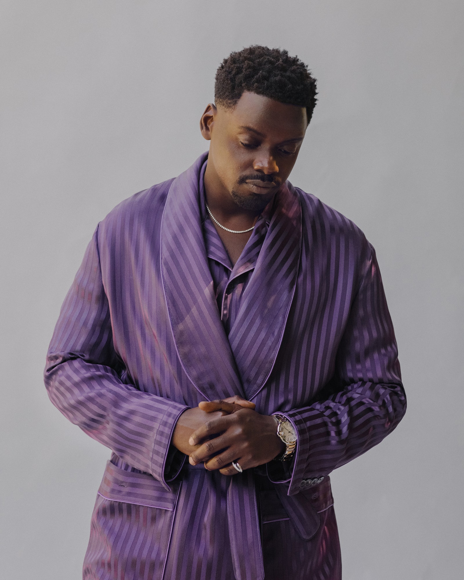 Daniel Kaluuya wearing a purple robe suit