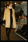Image may contain: Clothing, Apparel, Coat, Human, Person, Overcoat, Christy Turlington, and Fashion