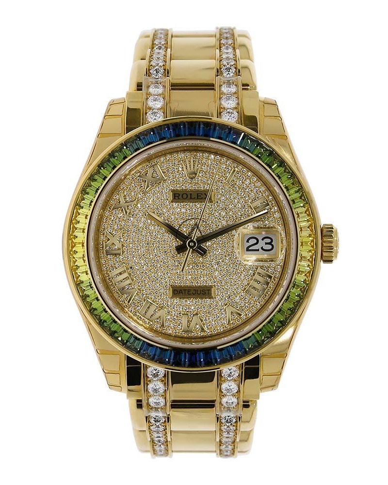 A gold watch with a gold face and diamonds embedded