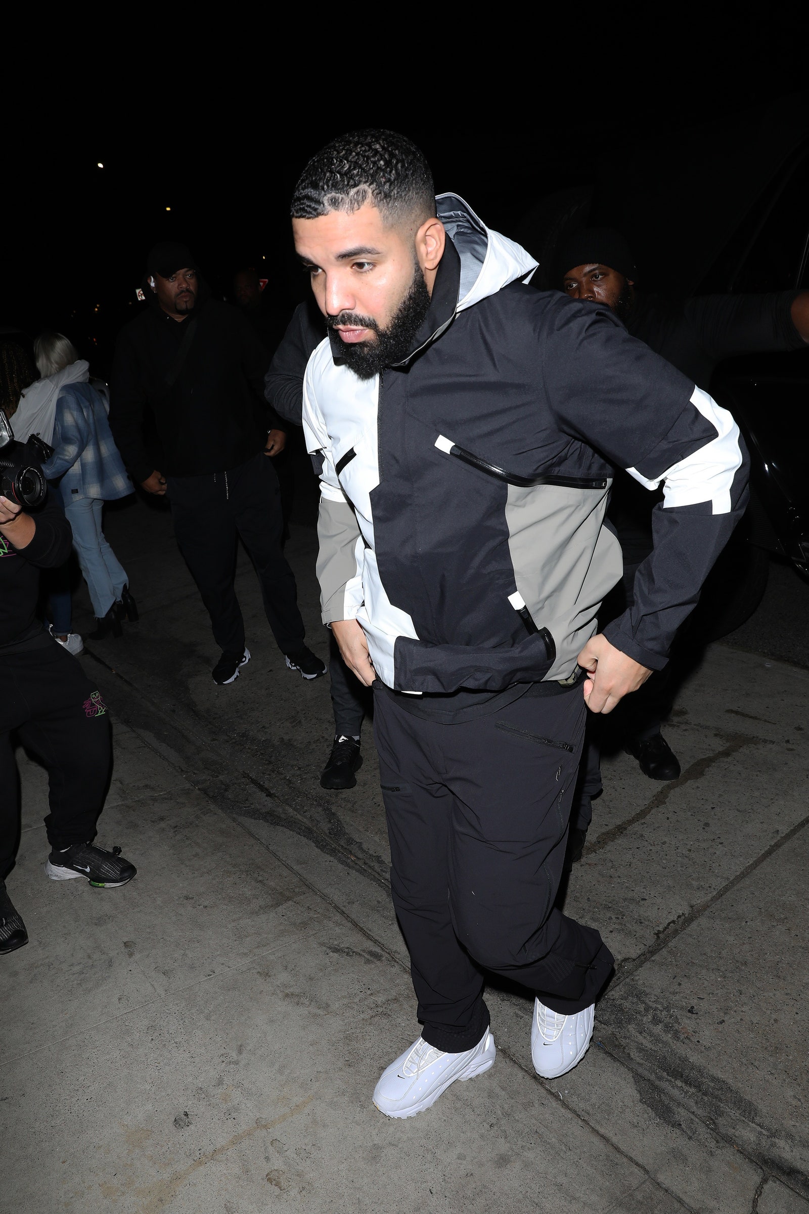 Image may contain Drake Clothing Shoe Footwear Apparel Human Person Suit Coat Overcoat and Face
