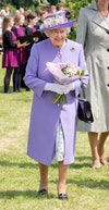 Image may contain: Elizabeth II, Human, Person, Hat, Clothing, Apparel, Plant, Flower, Flower Bouquet, and Flower Arrangement