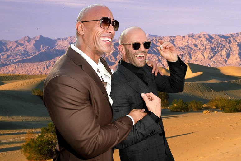 A collage of The Rock and Jason Statham hugging and smiling on a background of a desert