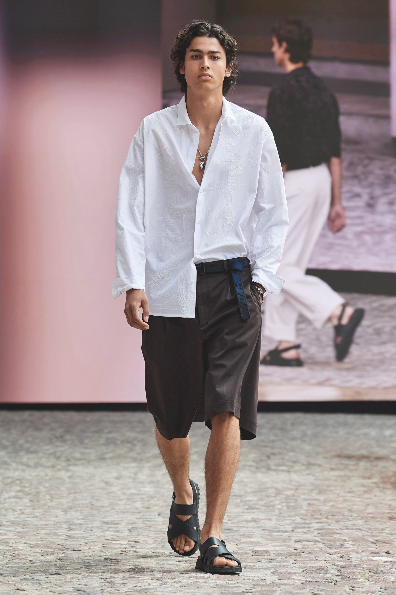 Image may contain Clothing Apparel Human Person Shirt Sleeve Shoe Footwear and Long Sleeve