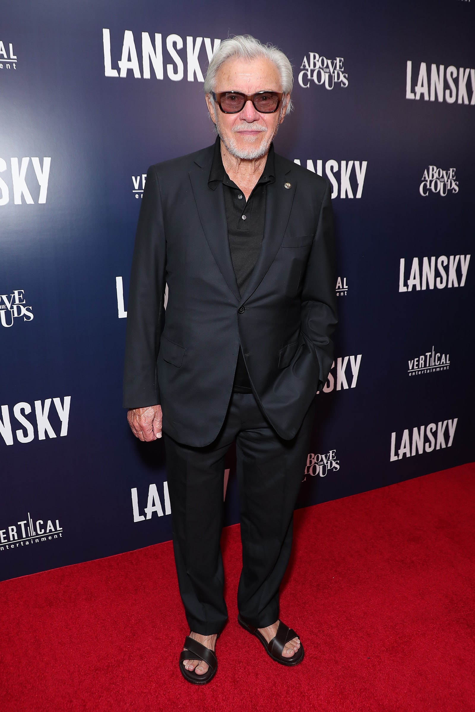 Image may contain Fashion Premiere Red Carpet Red Carpet Premiere Clothing Suit Overcoat Apparel Coat and Human