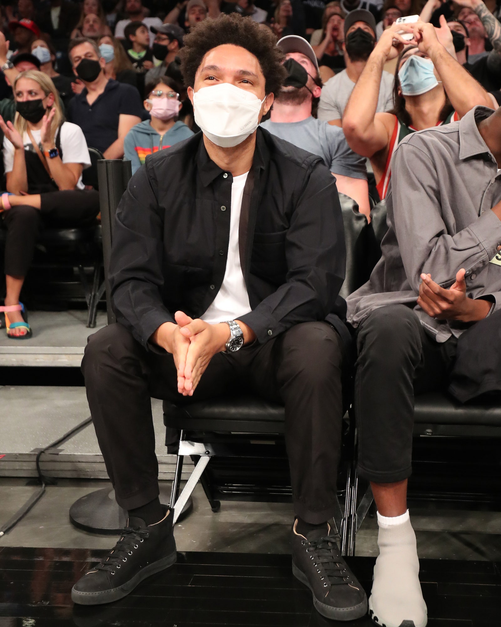 The Daily Show host Trevor Noah attends the Brooklyn Nets game against the Milwaukee Bucks