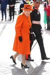 Image may contain: Elizabeth II, Human, Person, Hat, Clothing, Apparel, Military Uniform, Military, Footwear, Shoe, and Coat