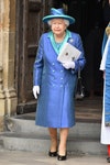 Image may contain: Elizabeth II, Clothing, Apparel, Coat, Hat, Overcoat, Sleeve, Human, Person, Footwear, and Shoe