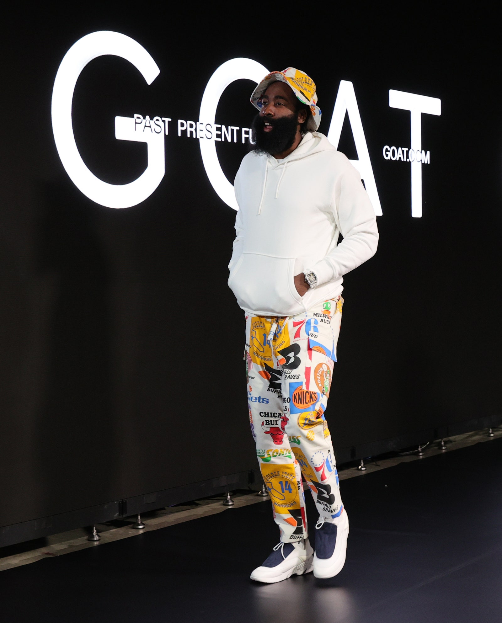 Image may contain Human Person Clothing Apparel Sleeve Stage and Tupac Shakur
