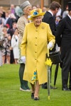 Image may contain: Elizabeth II, Clothing, Apparel, Coat, Hat, Human, Person, Suit, and Overcoat