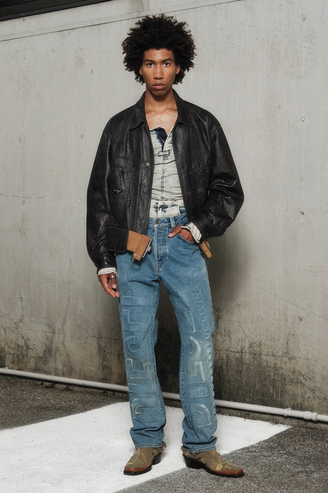 Embossed jeans and a sick leather jacket.
