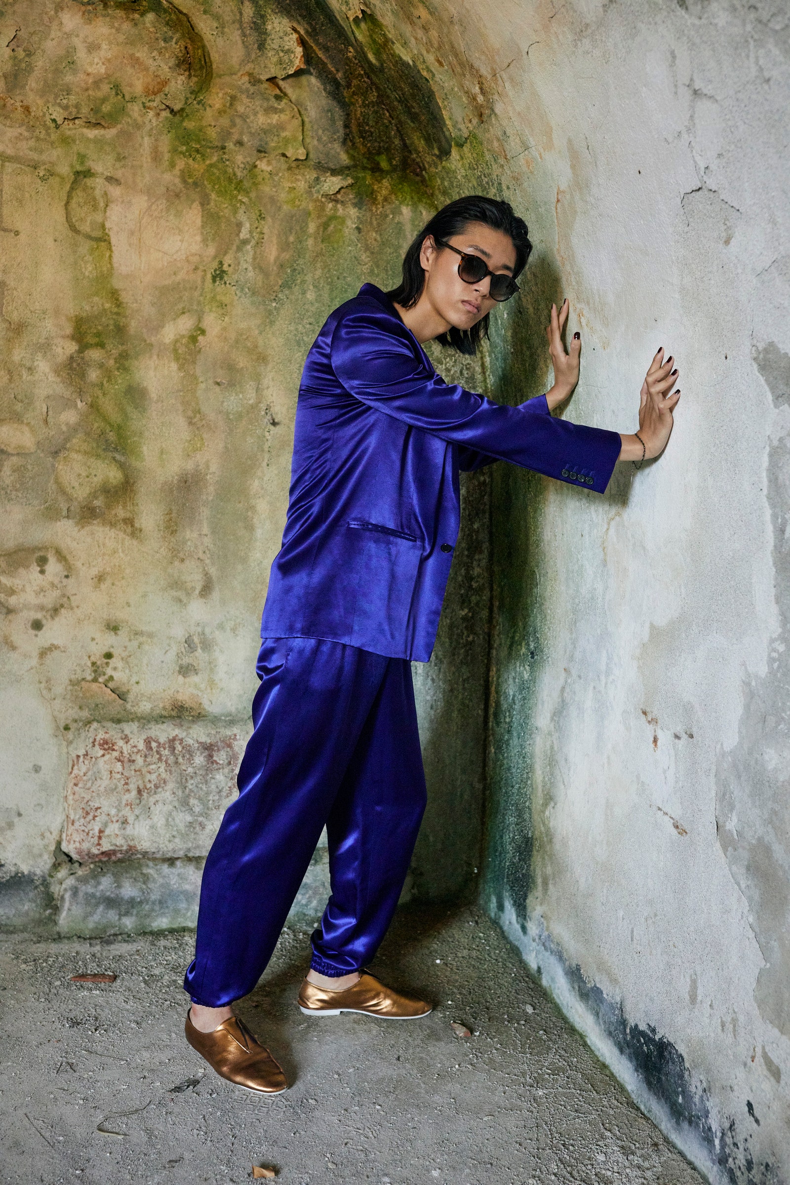 Image may contain Footwear Clothing Shoe Apparel Sleeve Sunglasses Accessories Accessory Human Person and Pants