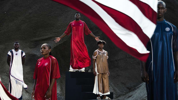 Telfar Olympics From Left to Right- Joseph Fahnbulleh (Olympian), Ebony Morrison (Olympian), Emmanuel Matadee (Olympian), Telfar Clemens (Designer), Mohammed (stand-in model)