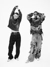 From left. Yura. Oversized hoodie in cotton, Givenchy; denim trousers in cotton, Dolce&Gabbana; Chuck Taylor All Star High Top, Converse. Ibrahim. Destroyed crewneck in Fair Isle knit and baggy trousers in Japanese denim, Balenciaga. Leather belts with metallic studs, Nanni Milano.