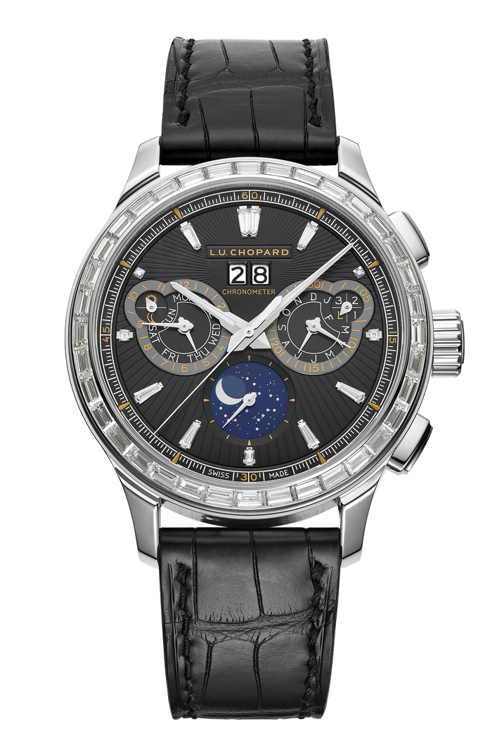A silver watch with a diamond encrusted bezel and black face