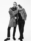 From left. Leon. Blouson with patchwork panel in wool, Dolce&Gabbana; jacket in lambskin and sheepskin leather, trousers in organic denim, belt in leather, Teddy derbies in calfskin leather, Saint Laurent by Anthony Vaccarello; socks, Alto Milano. Earring, Tant d’Avenir. Paul. Leopard jacket in leather, trousers in wool, necklace in metal, monk strap in calfskin leather, Saint Laurent by Anthony Vaccarello; vest in cotton, Boramy Viguier; tank top, Hanro.