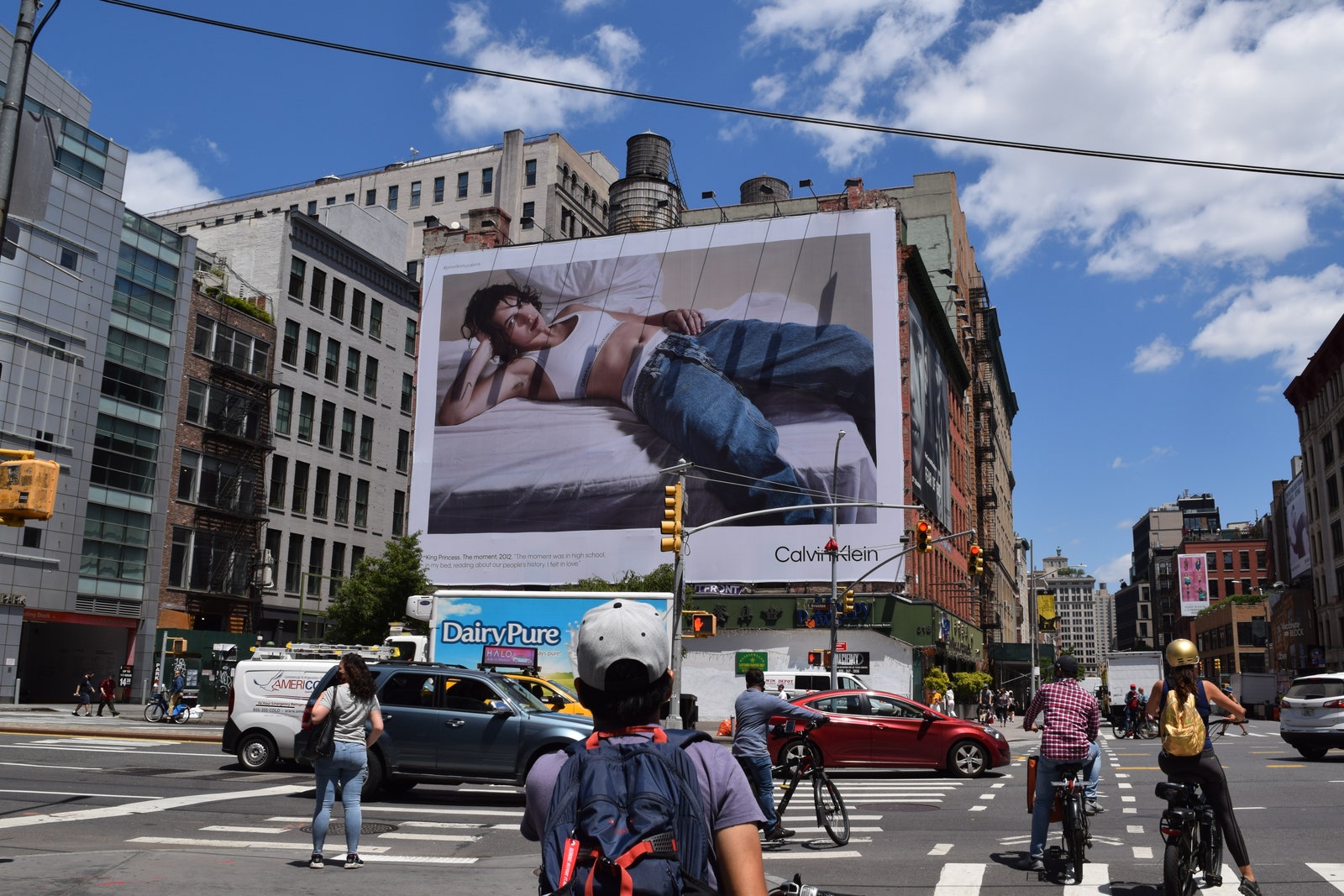 Image may contain Asphalt Tarmac Human Person Road Helmet Clothing Apparel Pedestrian Car and Vehicle