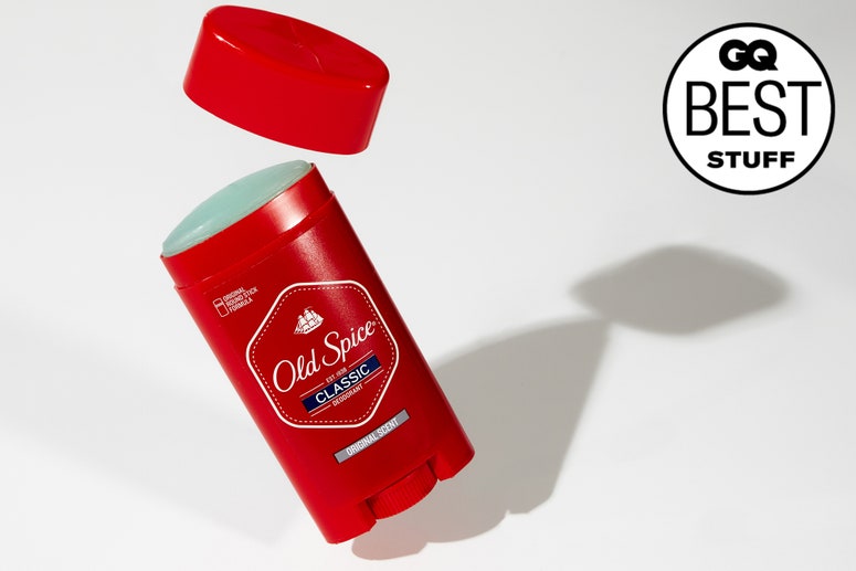 A red container of old spice deodorant on a white background