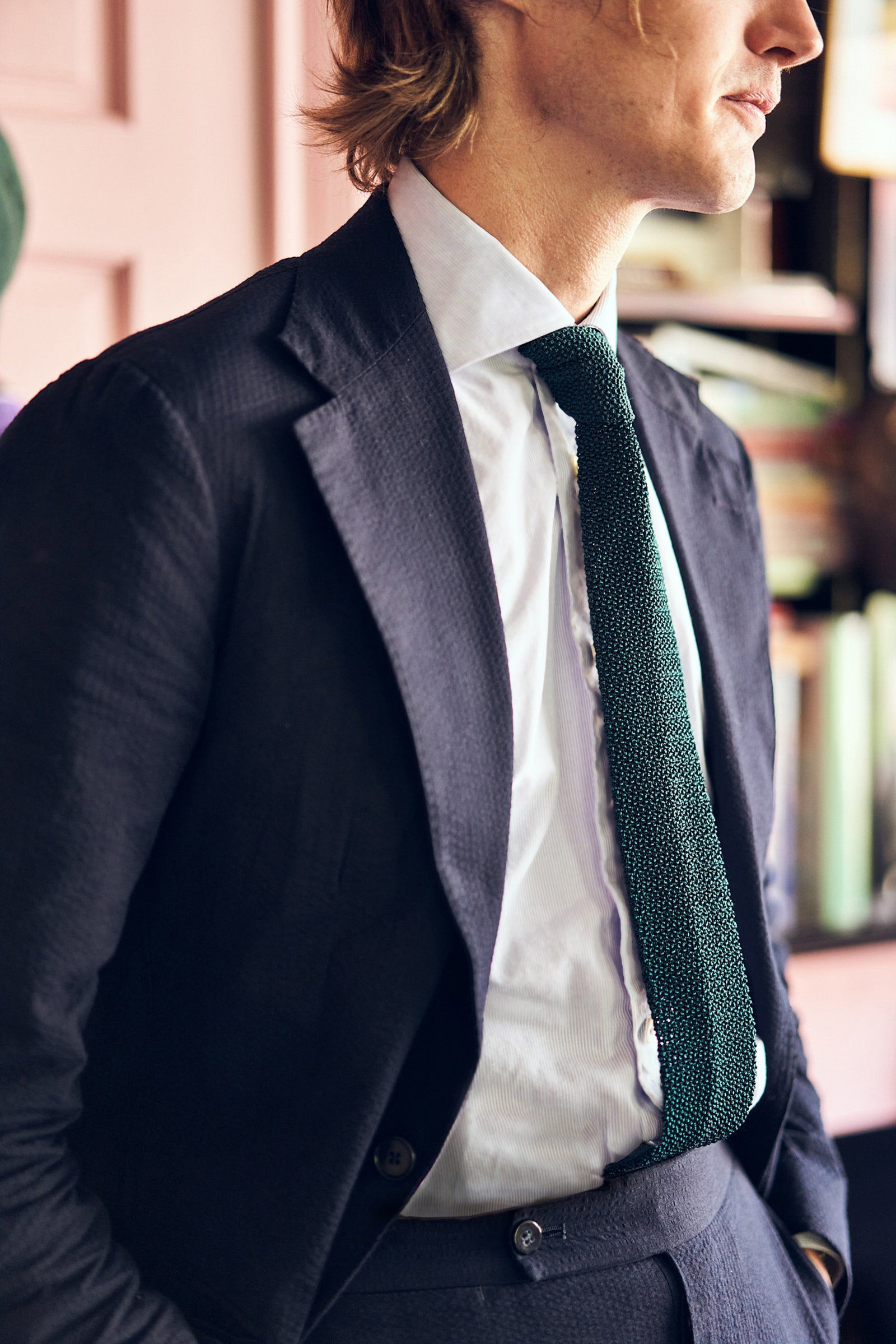 Image may contain Accessories Tie Accessory Necktie Clothing Suit Overcoat Apparel Coat Human and Person