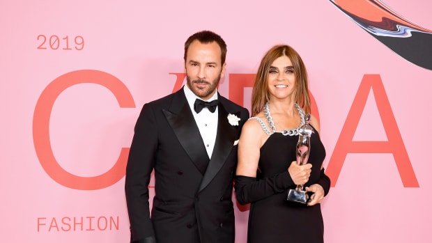 Carine Roitfeld poses the Founder's Award in Honor of Eleanor Lambert Award and Tom Ford during the Winners Walk during the CFDA Fashion Awards at the Brooklyn Museum of Art