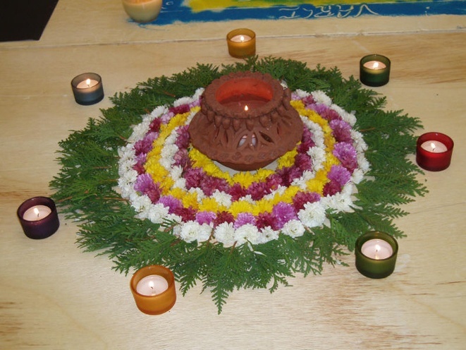 Rangoli from whole flowers and leaves