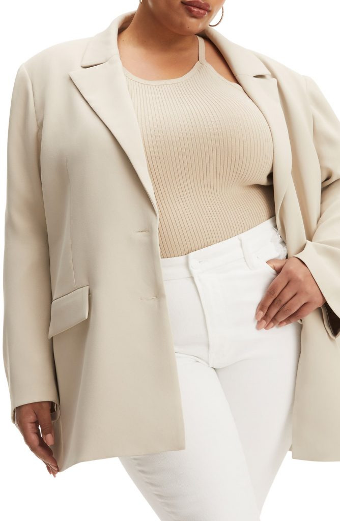 Woman wearing a cream colored oversized blazer