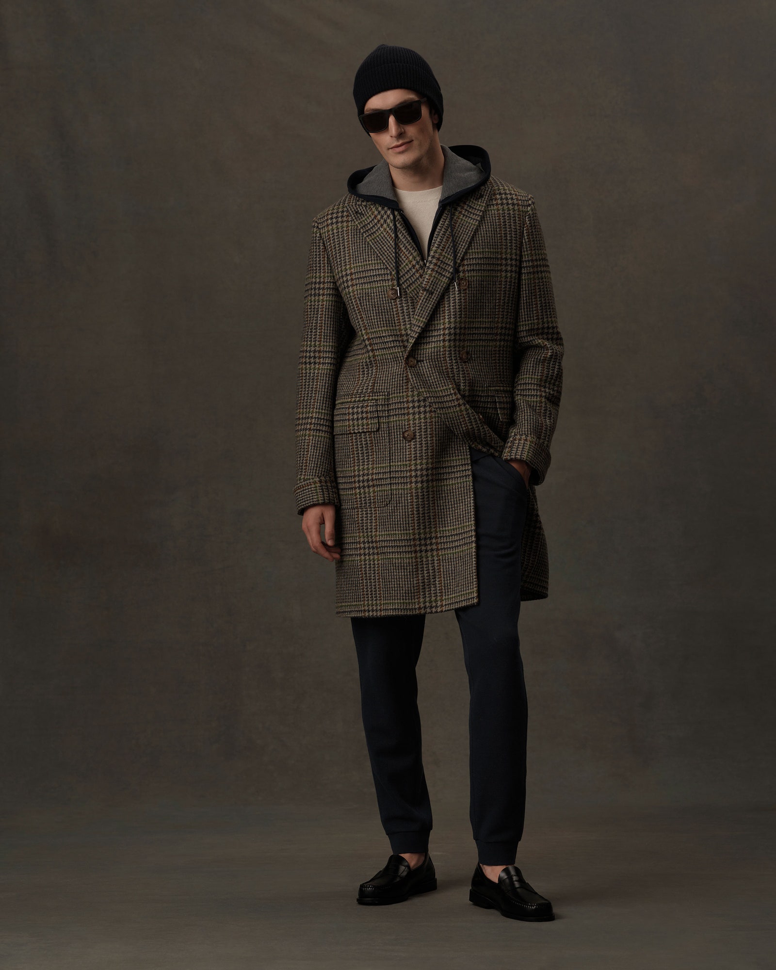 Image may contain Clothing Apparel Overcoat Coat Human Person Shoe Footwear Sunglasses Accessories and Accessory