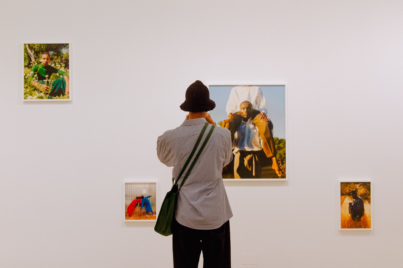 Image may contain Art Art Gallery Human Person Clothing Apparel Canvas and Hat