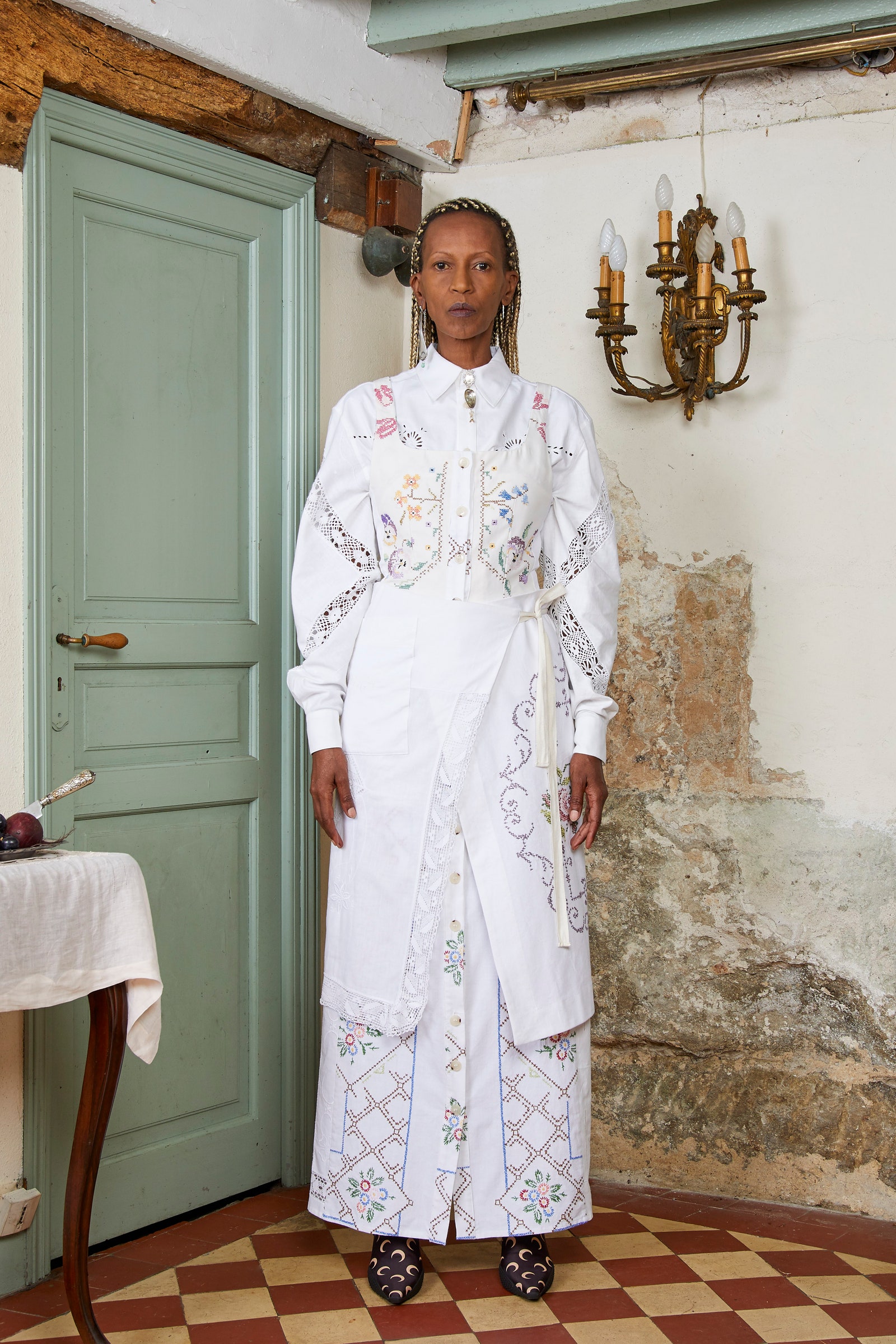 Image may contain Clothing Apparel Fashion Robe Human Person Gown Evening Dress and Home Decor
