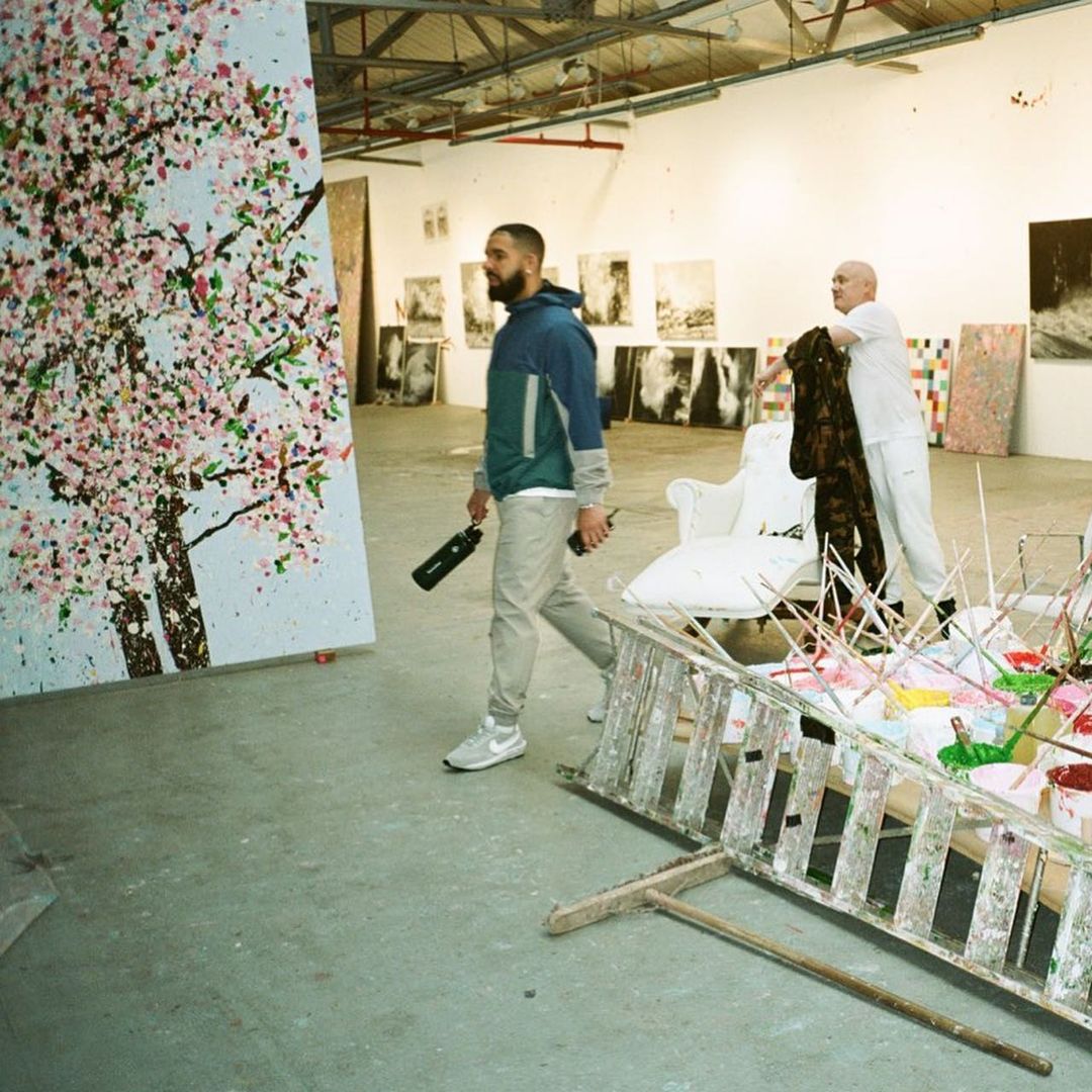 Image may contain Human Person Furniture Clothing Shoe Footwear Apparel Art and Drake