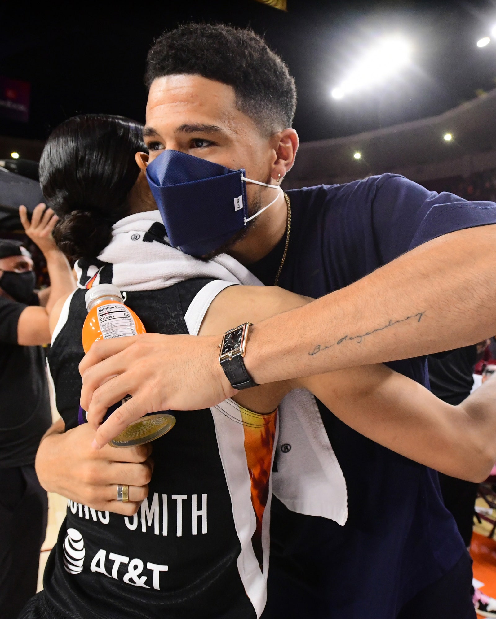 Devin Booker 1 of the Phoenix Suns hugs Skylar DigginsSmith 4 of the Phoenix Mercury after the game against the Las...