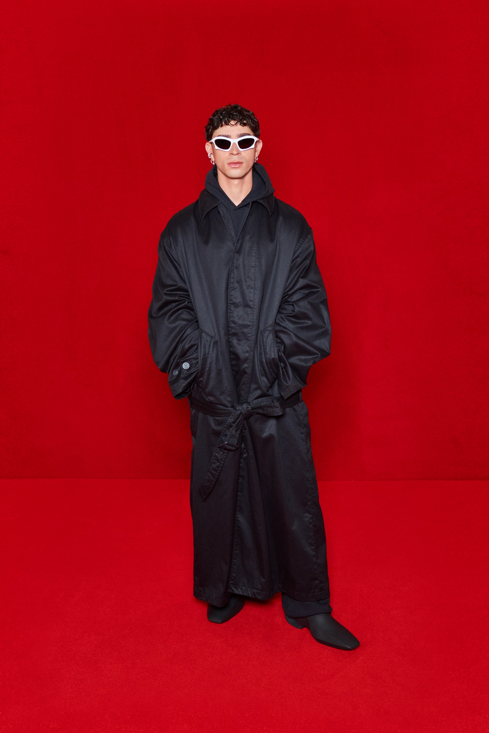Image may contain Clothing Apparel Coat Sunglasses Accessories Accessory Human and Person