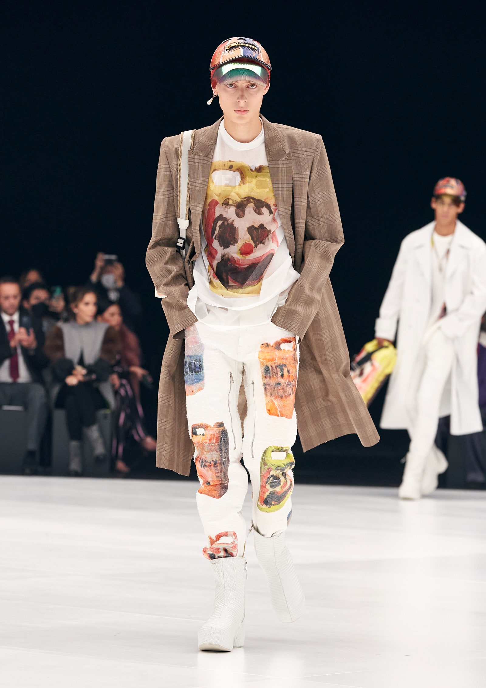 Image may contain Human Person Clothing Apparel Fashion Sleeve and Robe