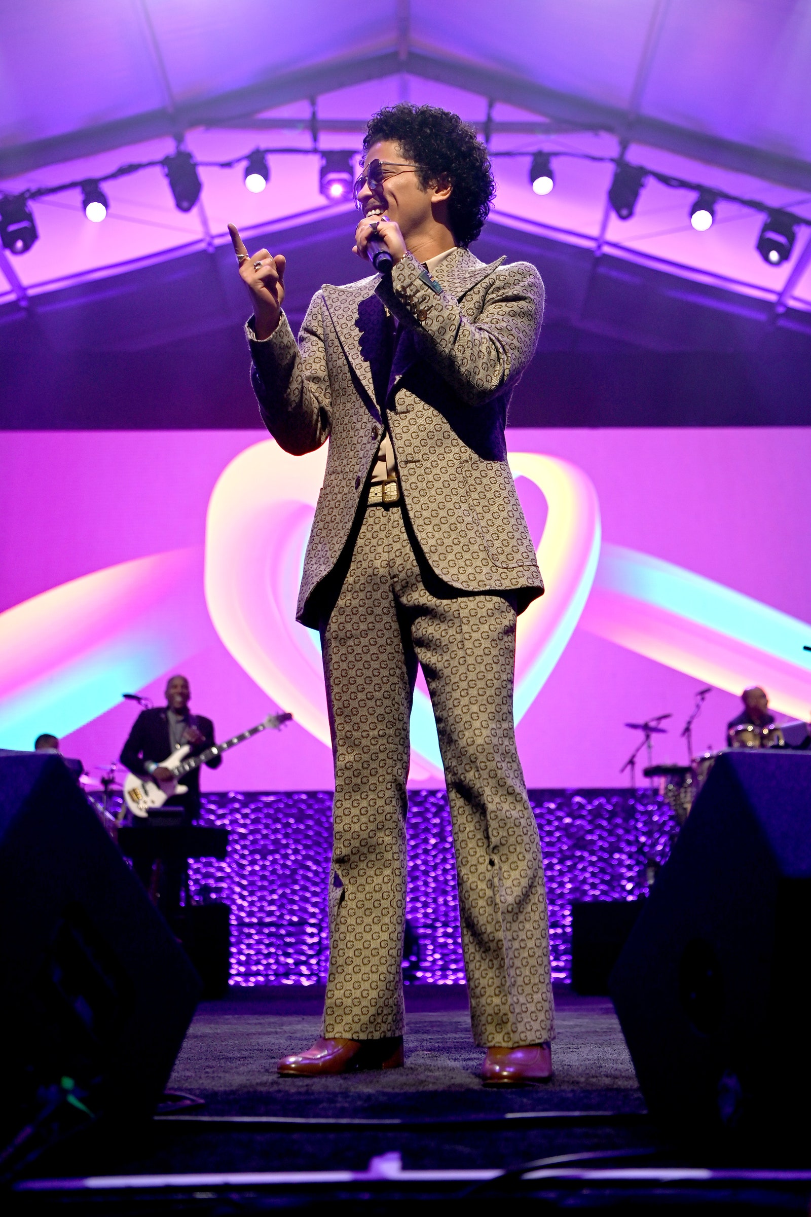 Image may contain Stage Musical Instrument Musician Human Person Guitar Leisure Activities Music Band and Bruno Mars