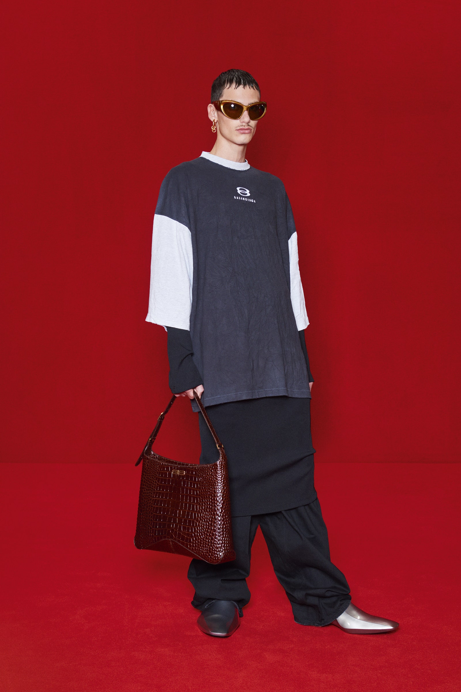 Image may contain Human Person Sunglasses Accessories Accessory Clothing Apparel Handbag Bag and Purse