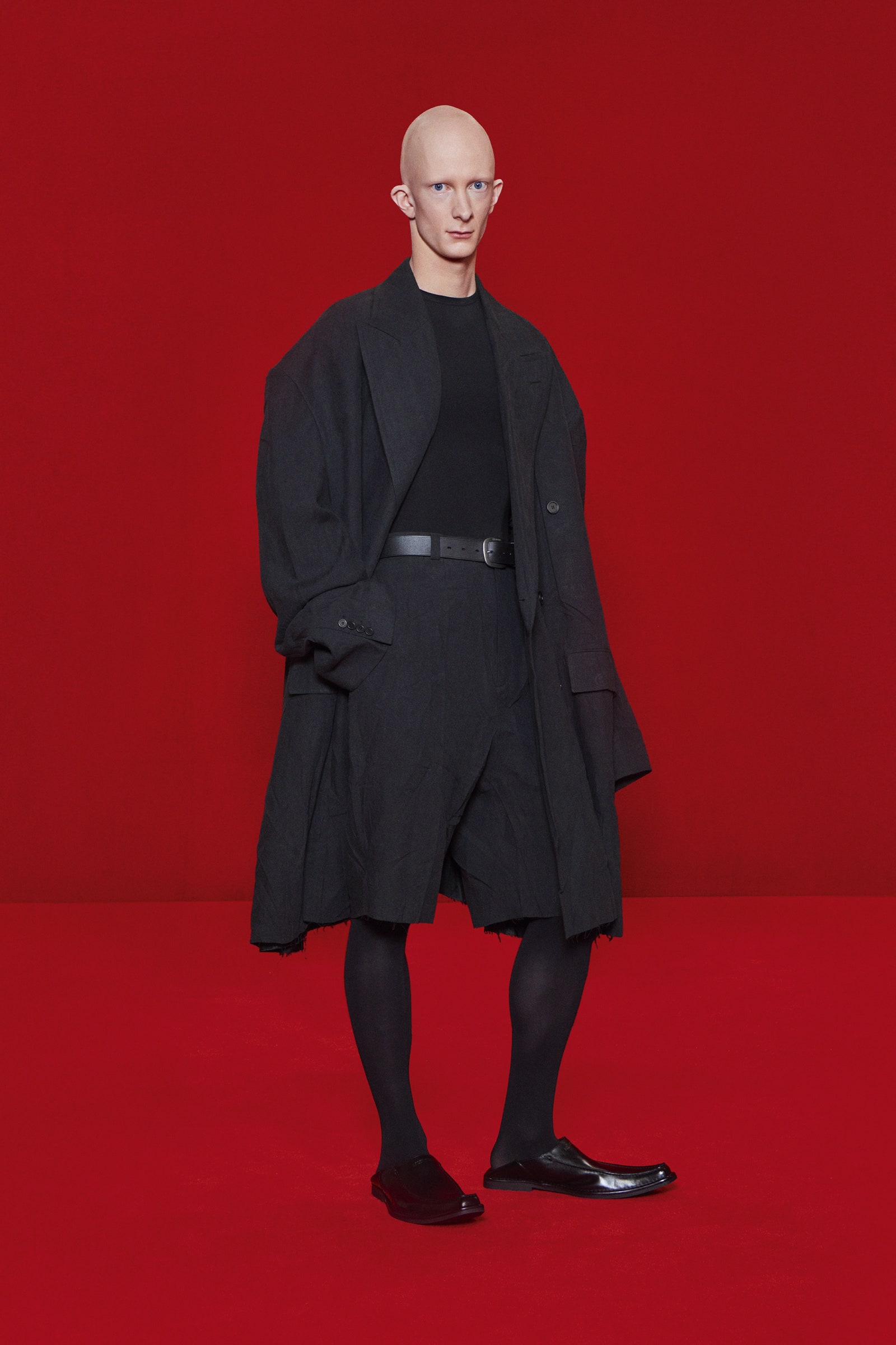 Image may contain Clothing Apparel Coat Overcoat Human Person and Fashion