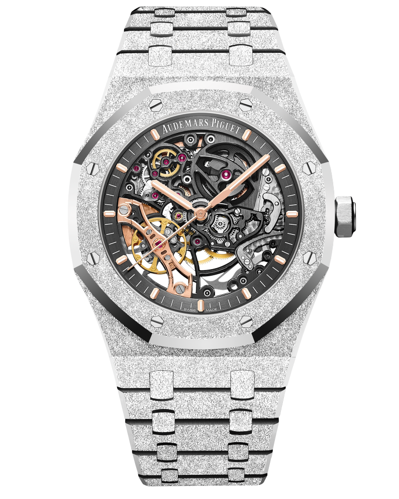 A steel watch with a transparent face revealing the watch mechanisms underneath