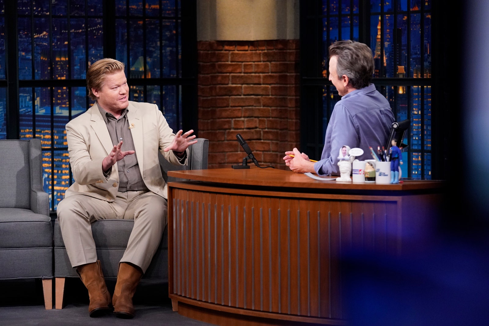 Image may contain Jesse Plemons Human Person Sitting Audience Crowd Speech Furniture Indoors and Room